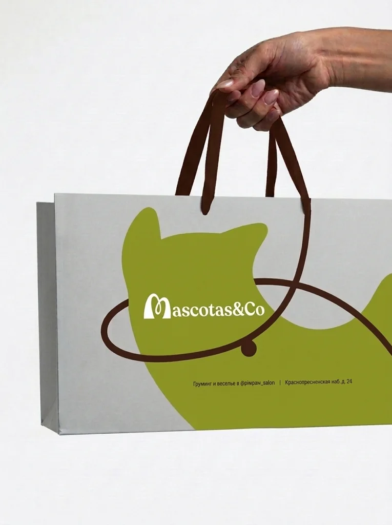 Bolsa de papel de Mascotas & Co con la silueta verde de un gato